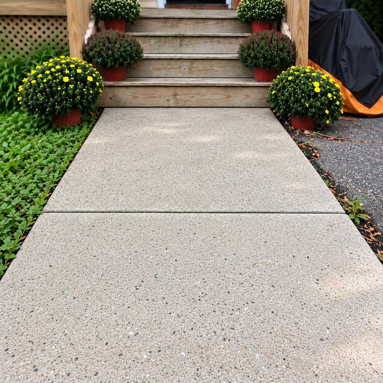 The same concrete walkway after cleaning and penetrating surface protection
