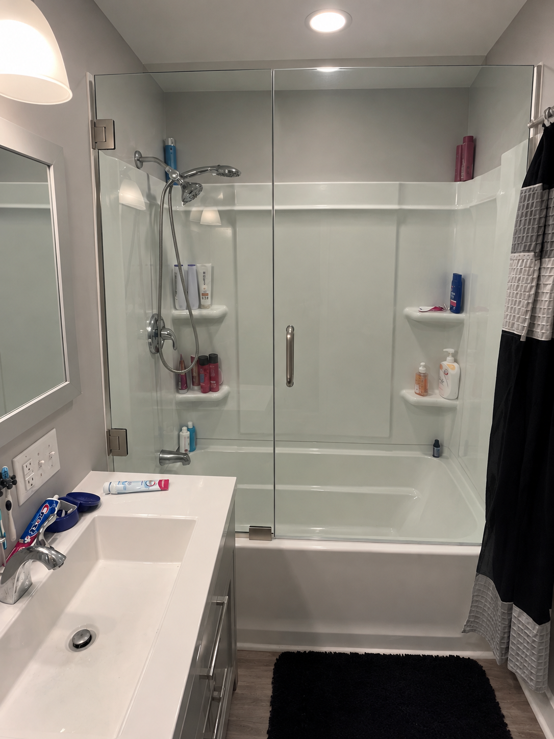 The same shower enclosure with clear glass after restoration and protective coating